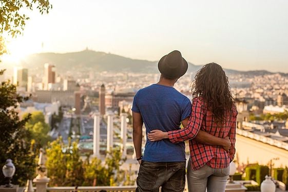 two people overlooking city